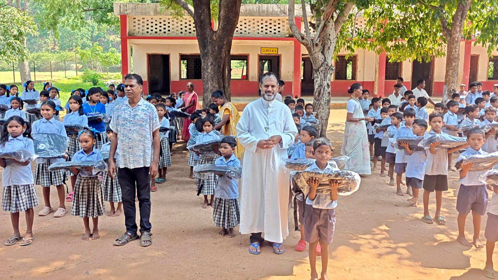 Goan priest gifts 500 school bags to 2 villages...